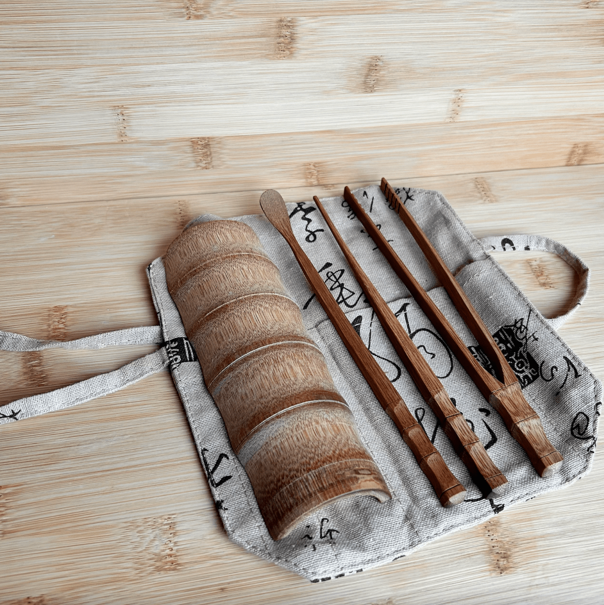 Bamboo Loose Tea Tool Set - marginnotesWooden chopsticks with a carrying case on a wooden surface