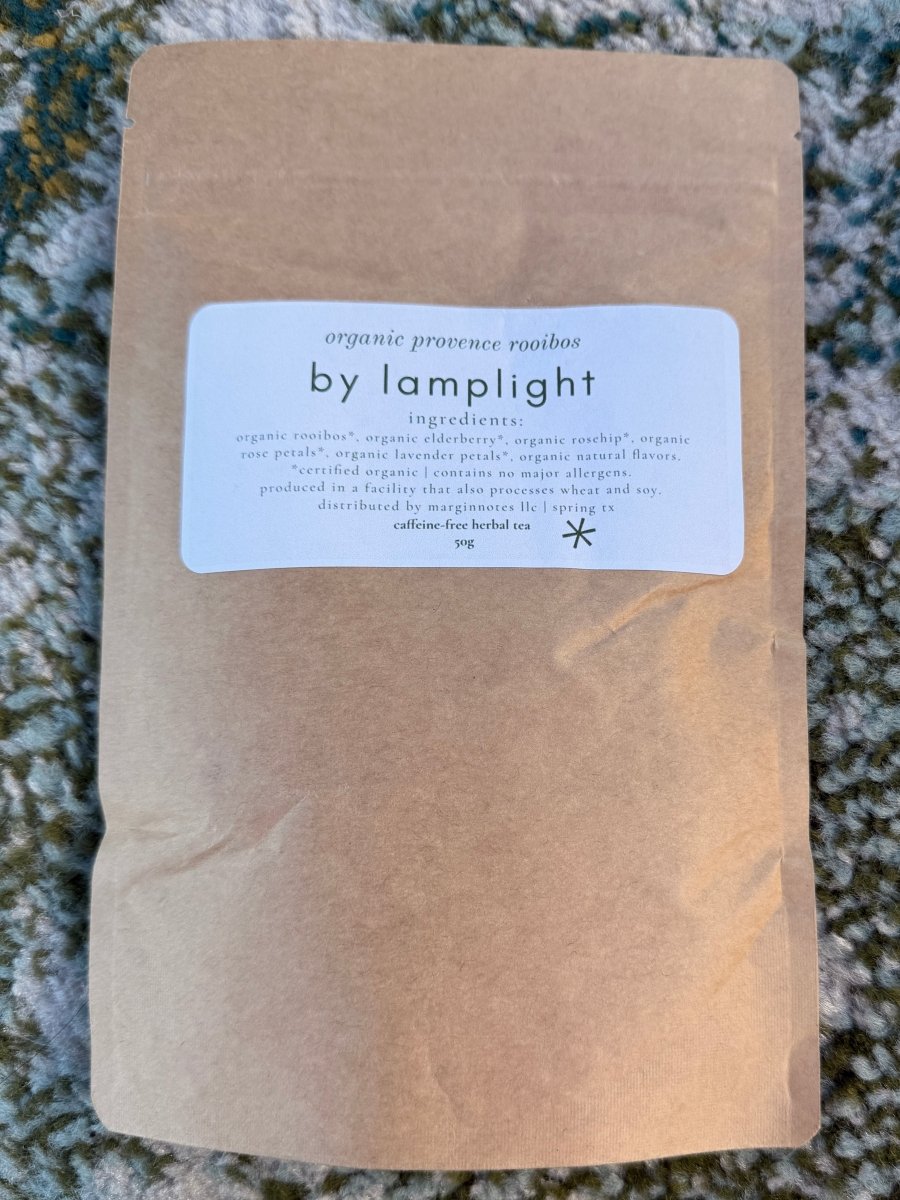 by lamplight loose leaf tea - marginnotesPackage with a label on a textured surface