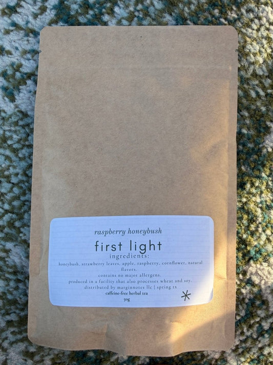 first light loose leaf tea - marginnotesKraft paper package with a label on a textured surface