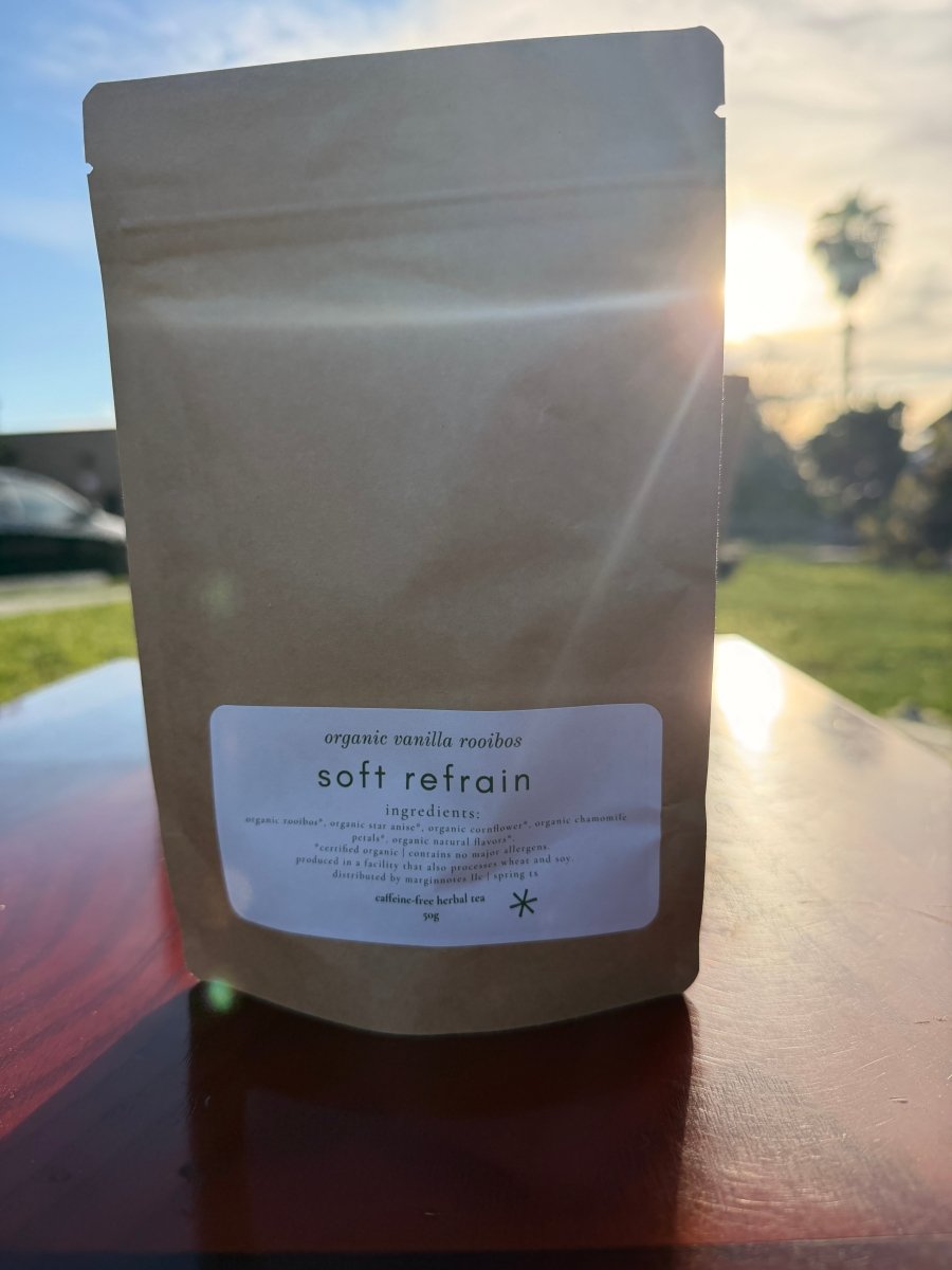soft refrain loose leaf tea - marginnotesProduct packaging with a label on a blurred outdoor background